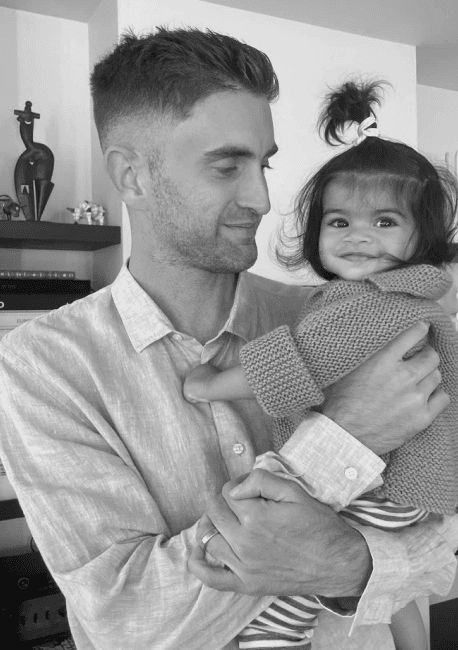 Chris holding his daughter