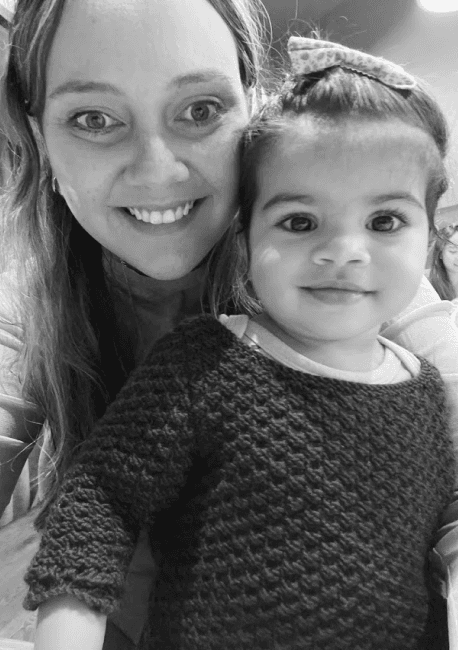 Sara sitting with niece on her lap